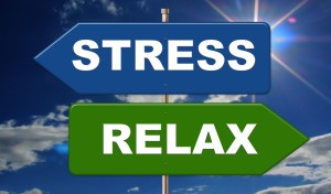 sign saying stress and one saying relax